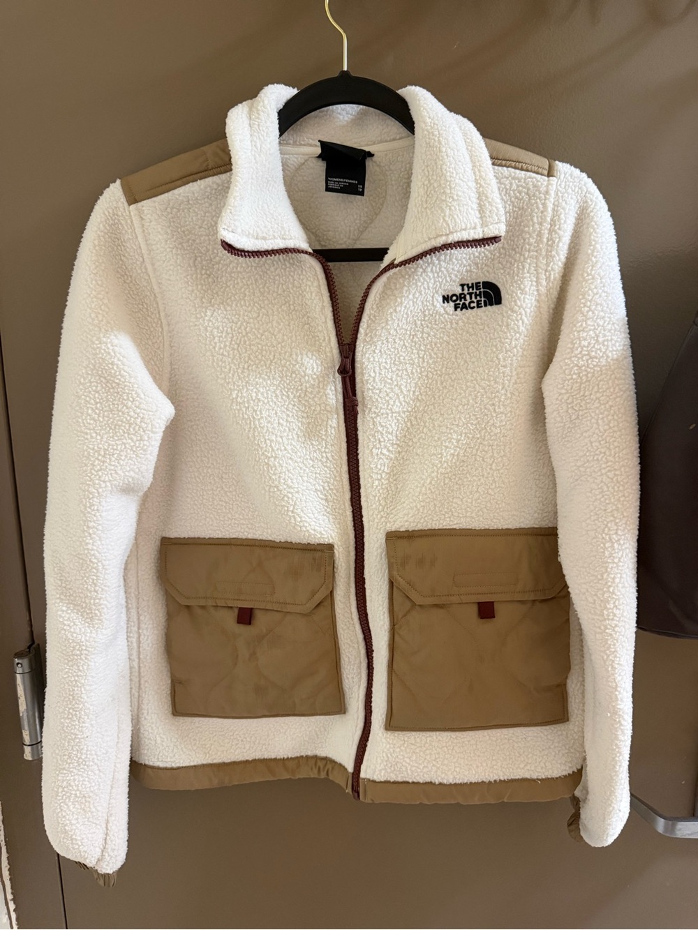 The North Face Cream Sherpa Jacket with Tan Pocket Accents
